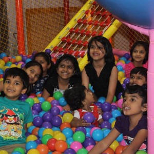 Group of Young Childern enjoying the birthday party with balls organised by the Birthday Party organizers