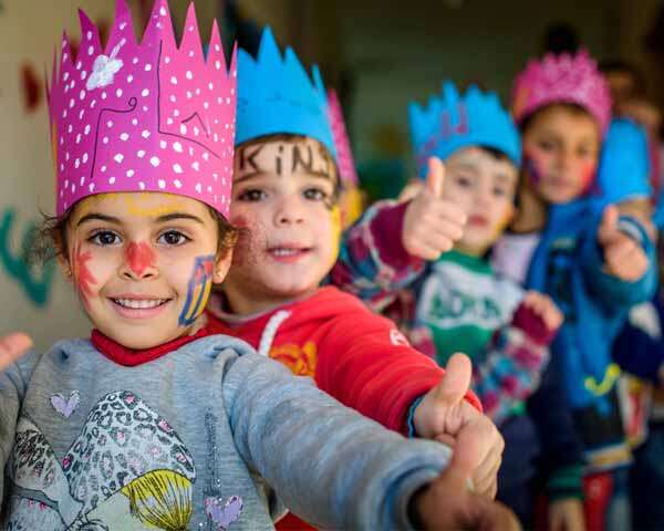 Cute & Happy Children Showing Thumbs Up In A Party Celebration.