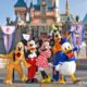 Cute Micky Mouse Family Standing Infront of Disneyland Themed Party Celebration.